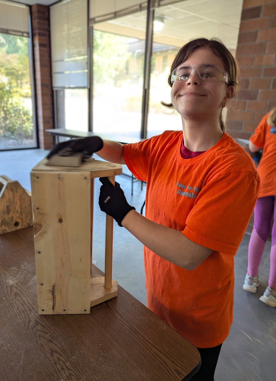 Steel Toe Teens camper working on a tool box