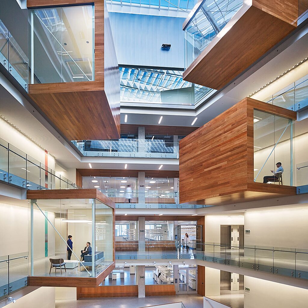 Interior photo of modern styled, life-science office building with floating meeting rooms