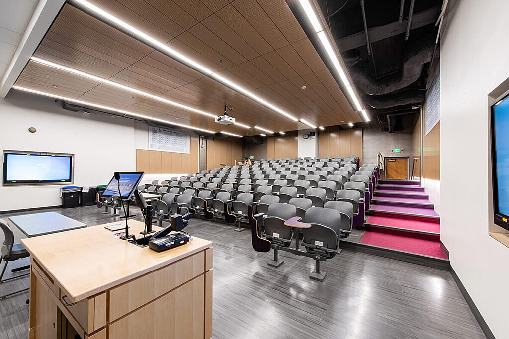 Bagley Hall classroom has rows of seats on an incline and an instructor podium at the front of room