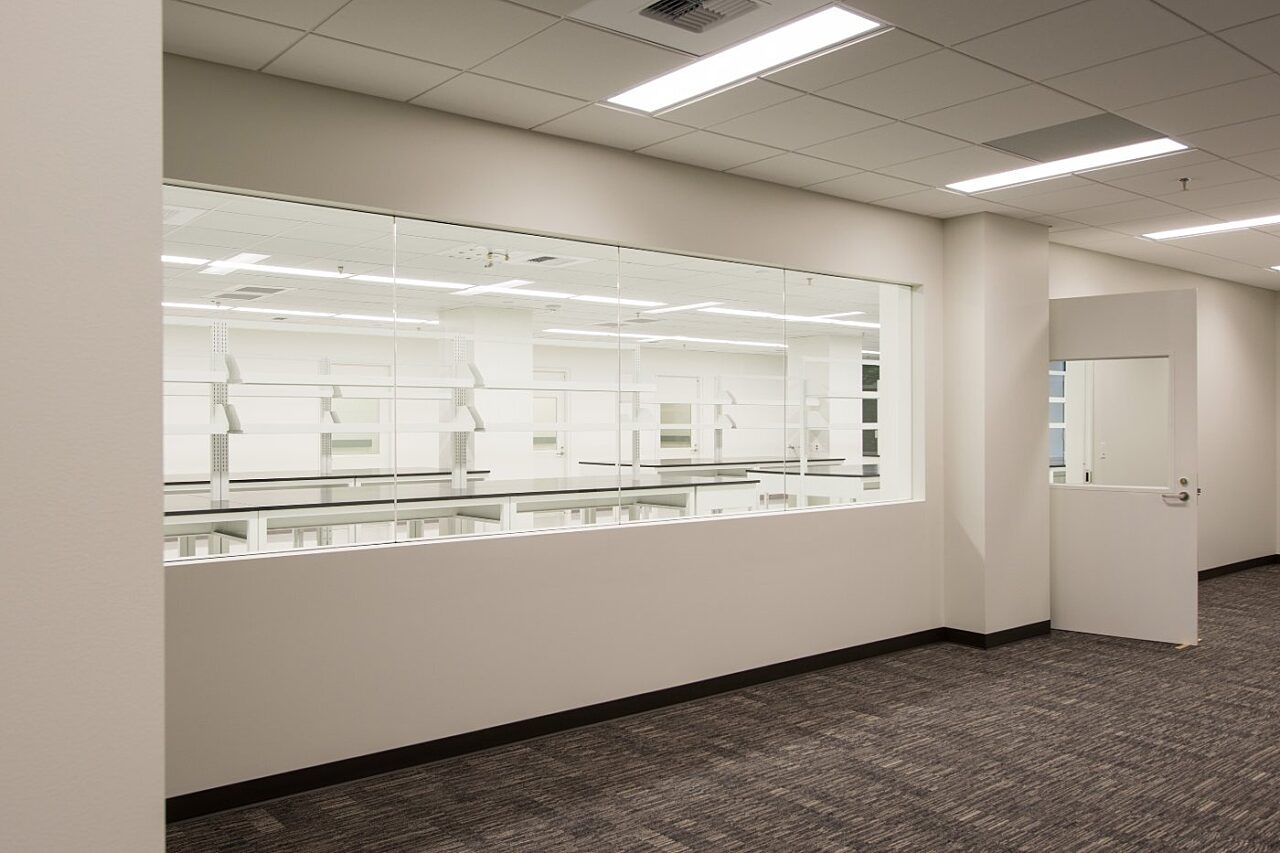 A look into a lab room from the hallway at The Labs at 201 Elliott