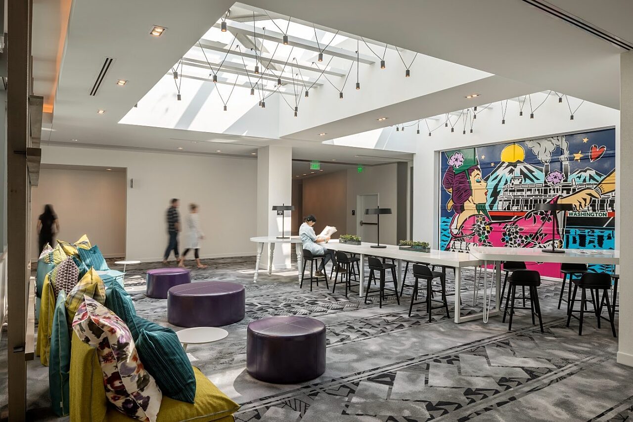 Common space and lounge area with wall art mural at W Hotels Bellevue
