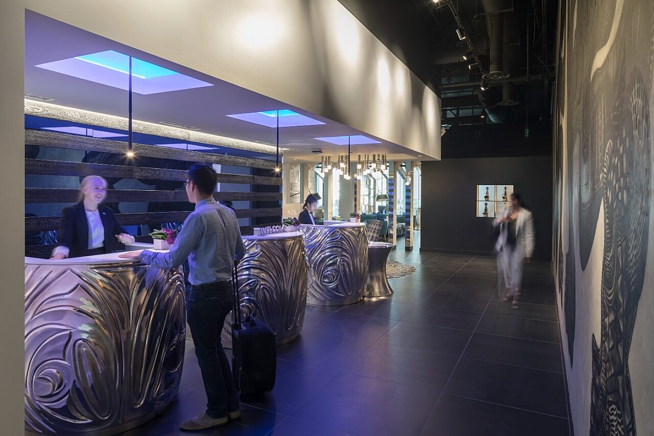 Reception and check-in area with freestanding metal desks at W Hotels Bellevue