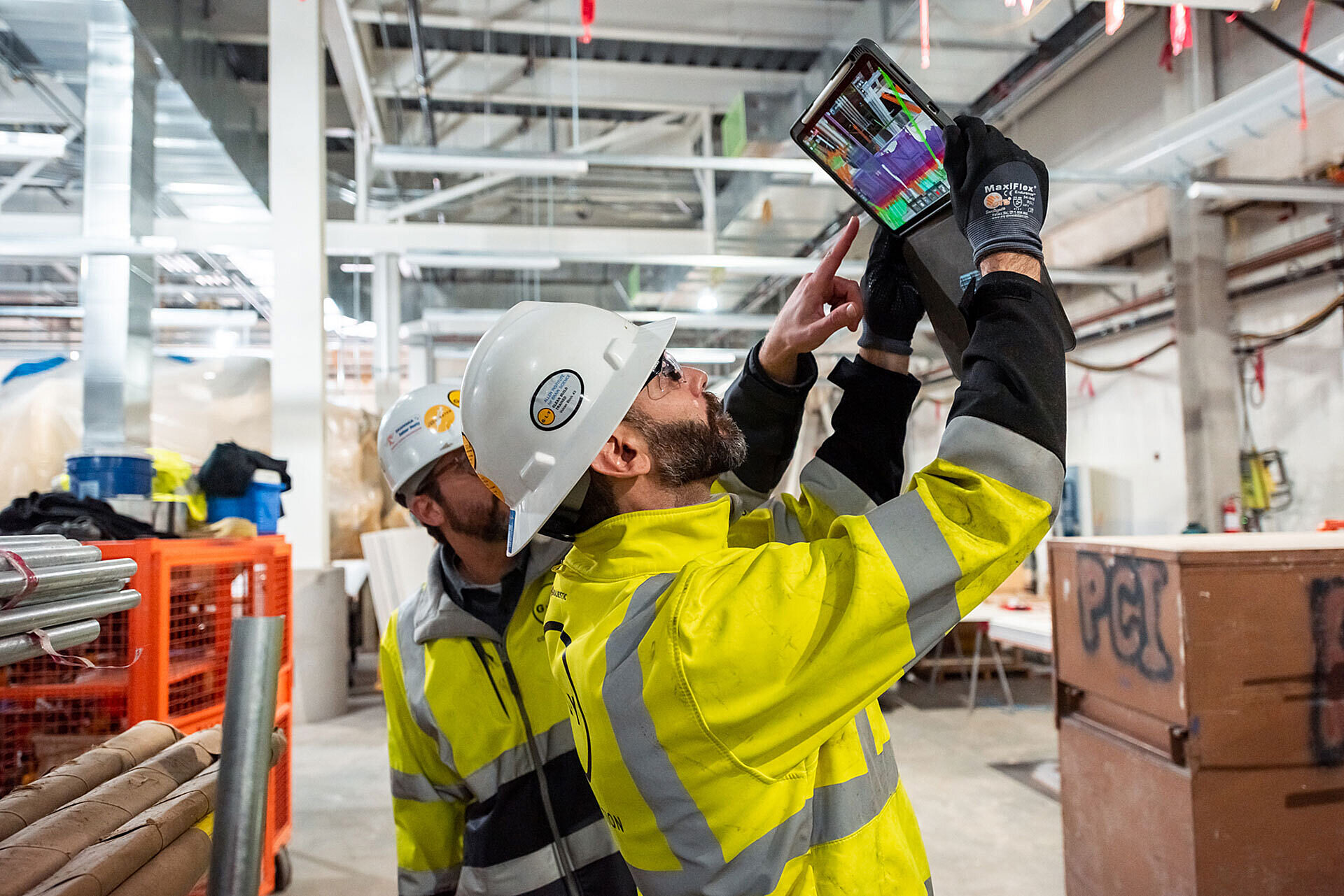 Construction worker using AR to scan interior with tablet