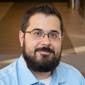 Headshot of Chris Mela