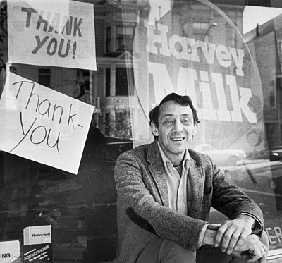 Black and white photo of Harvey Milk, visionary civil and human rights leader.