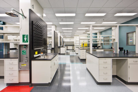 Interior photo of finished lab space including multiple lab desks and work areas
