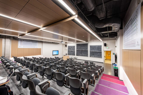 Bagley Hall classroom has rows of seats and a wall of blackboards at the front